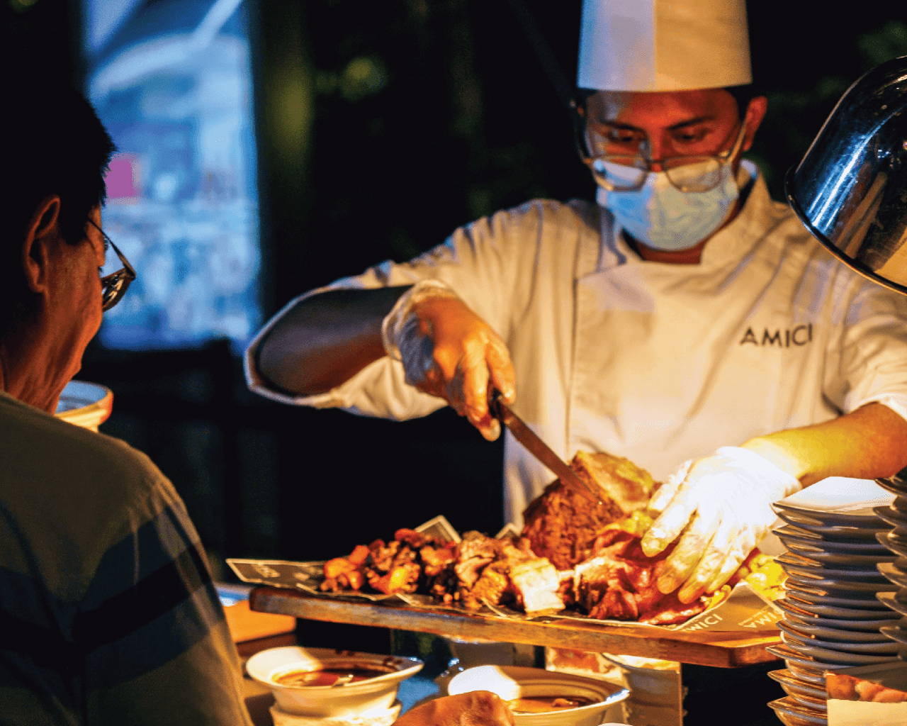 AMICI chef cooking at a live station