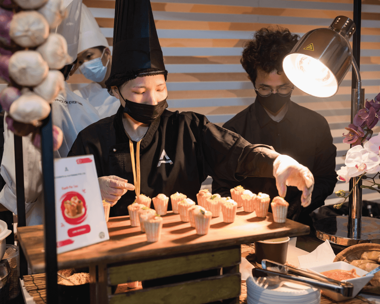AMICI chef serving at a live station