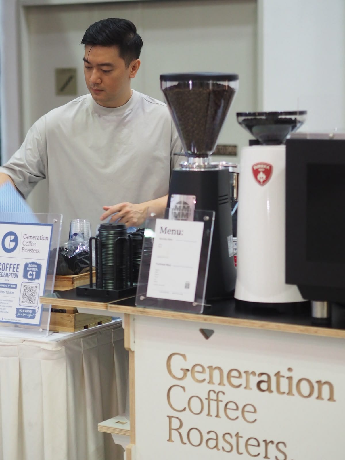 Barista preparing drinks at the Generation Coffee Roasters live station