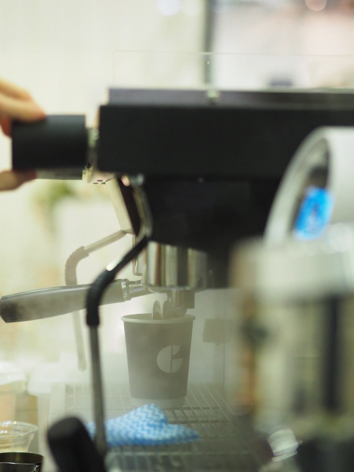Fresh coffee being brewed into a Generation Coffee Roasters cup