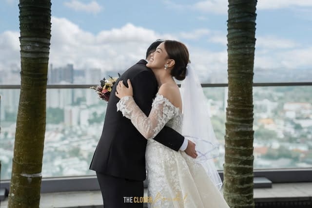 Newlywed couple embracing after their wedding ceremony