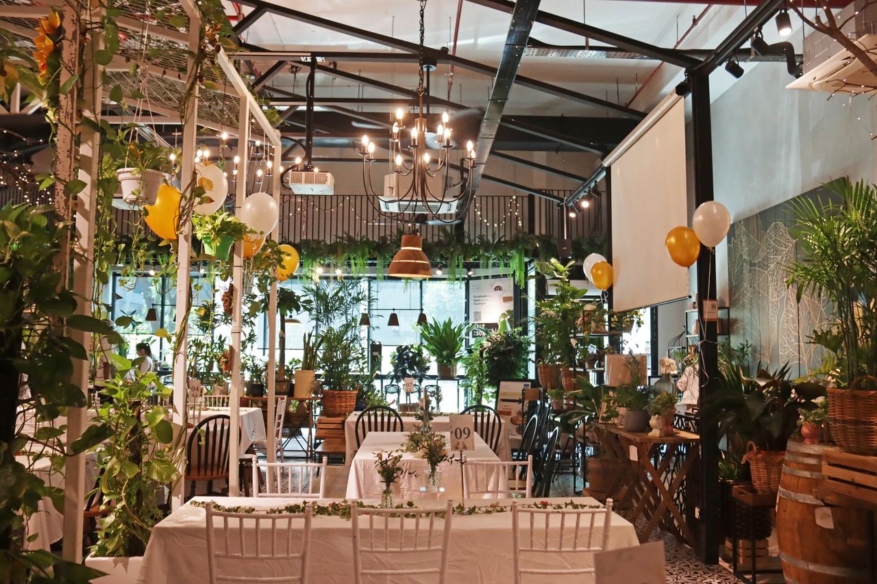 Wedding reception layout with chandeliers and greenery at Knots Cafe & Living