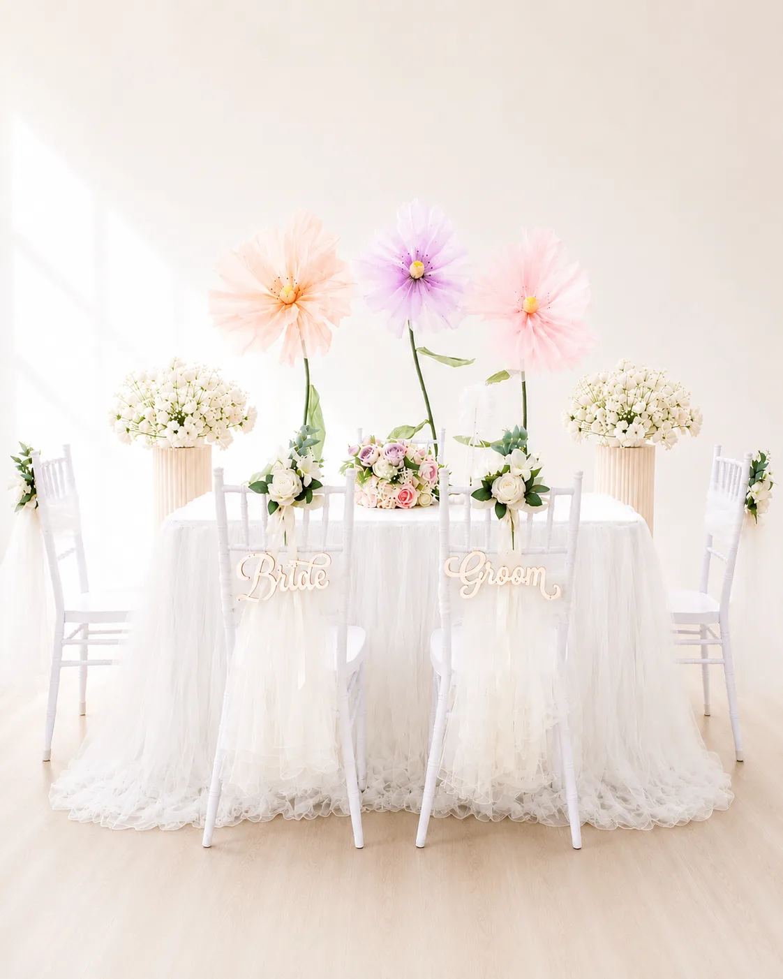 Pastel solemnisation table styling with Bride and Groom chair signs