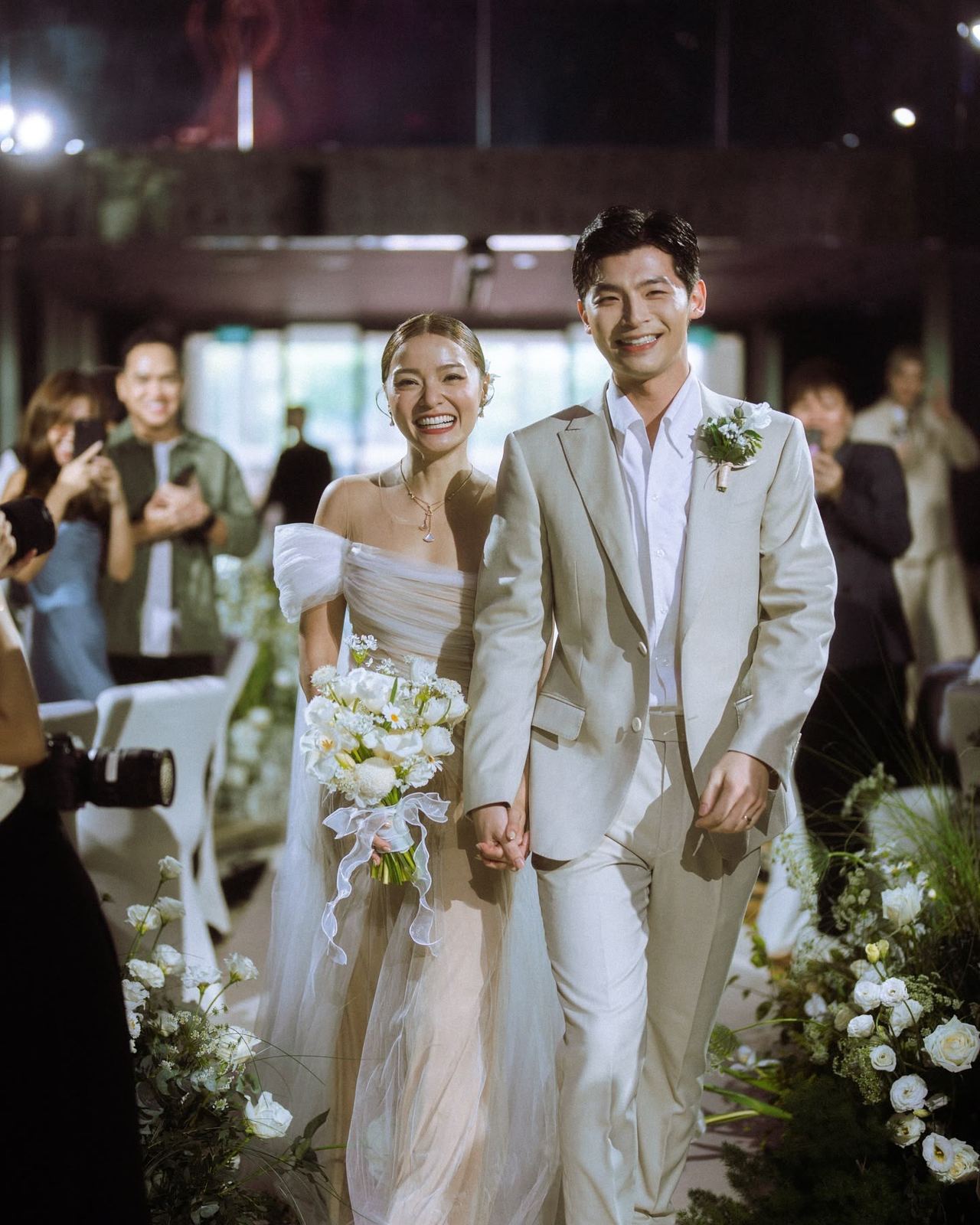Newlyweds walking down the aisle after their ceremony