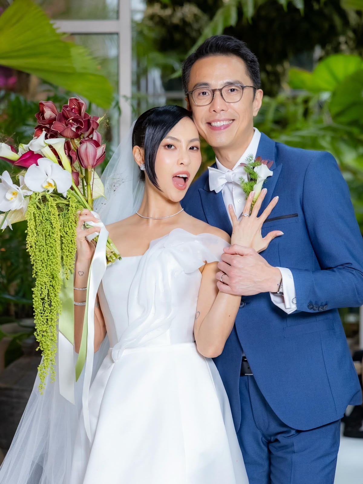 Bride and groom posing together after groom and family styling