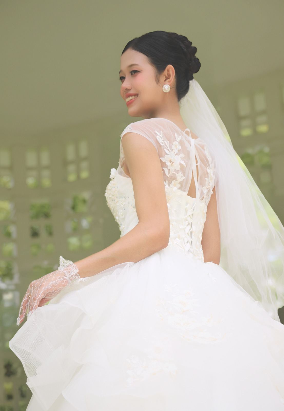 Bride in a white gown posing outdoors