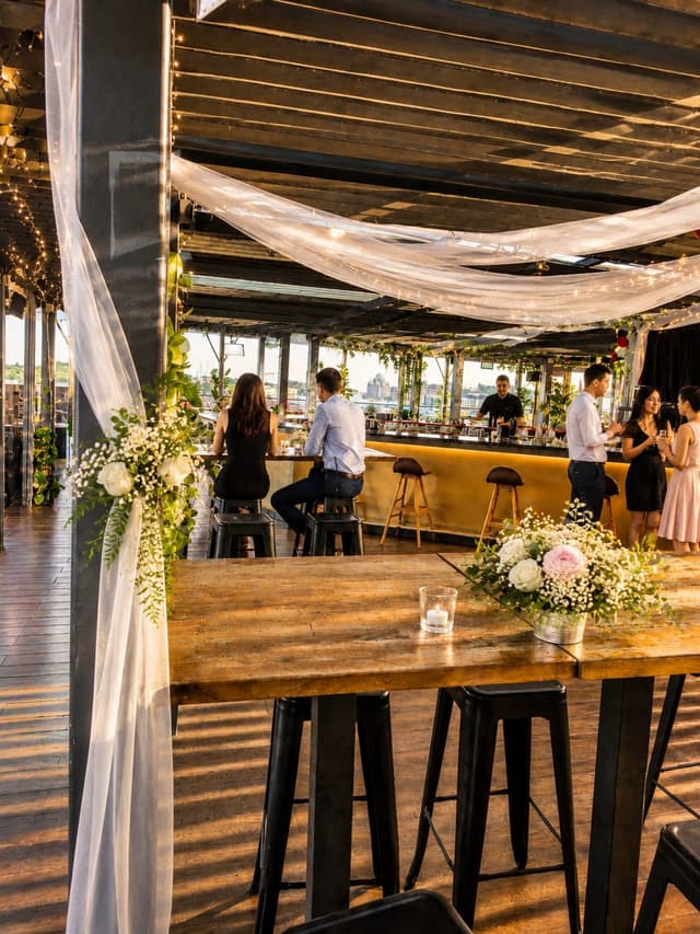 Rooftop bar decorated for a wedding at Sip Society