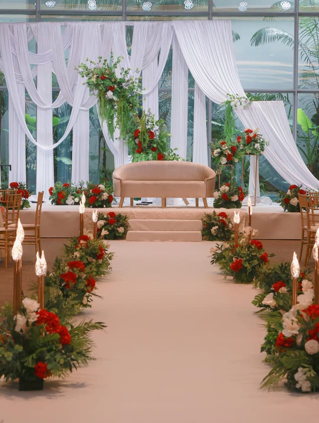 Red and white floral wedding aisle at GEM Grand Ballroom