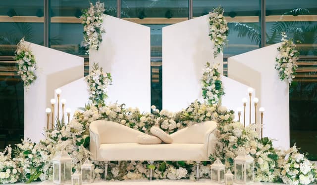 White floral wedding stage and sofa at GEM Grand Ballroom