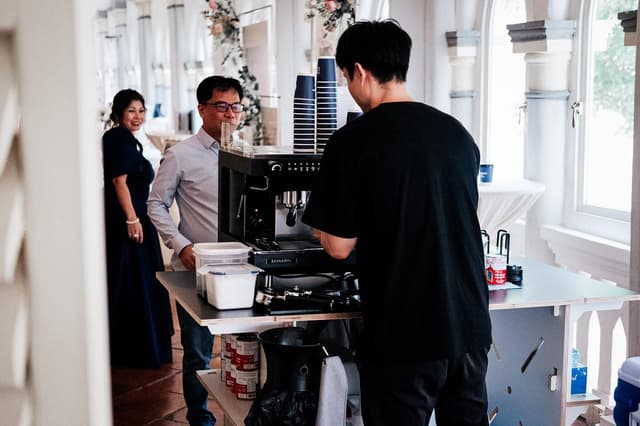 Generation Coffee Roasters barista serving guests at a wedding reception