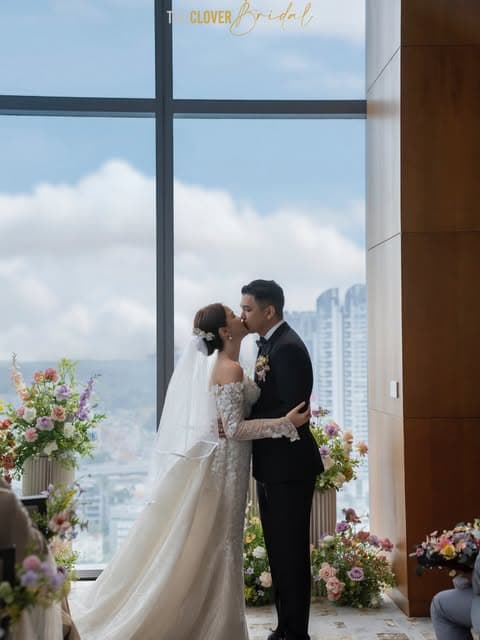 Bride and groom sharing a kiss during their wedding celebration