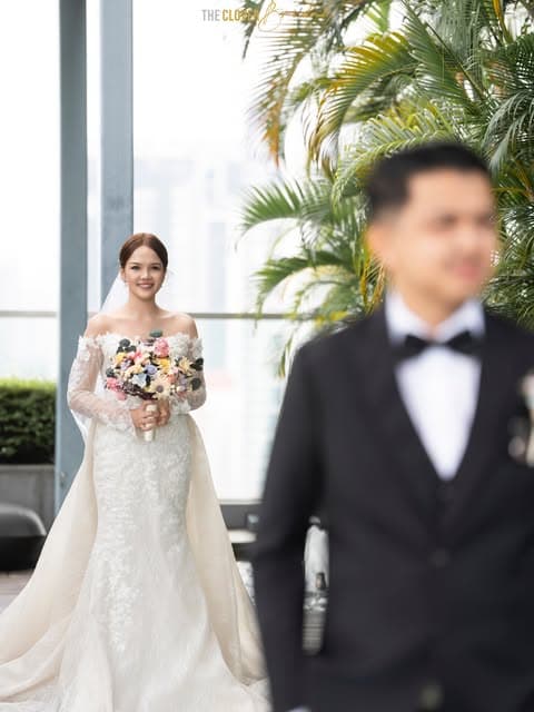 Bride approaching the groom in her wedding gown