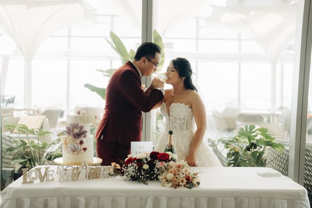 Newlyweds sharing a champagne toast at Altro Zafferano