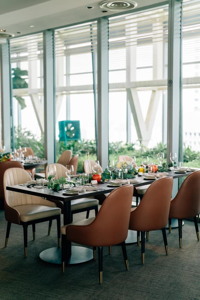 Wedding table setting beside the windows at Altro Zafferano