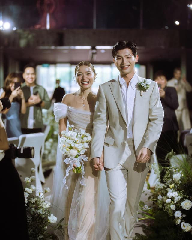 Newlyweds walking down the aisle after their ceremony