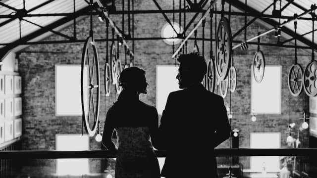 Black-and-white wedding portrait overlooking The Warehouse Hotel lobby
