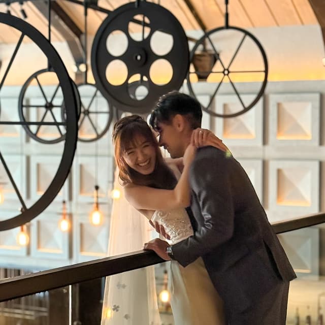 Wedding couple beneath the hanging lights at The Warehouse Hotel