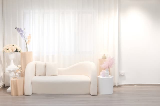 KEI Studio Lifestyle Area with white sofa and pastel floral styling