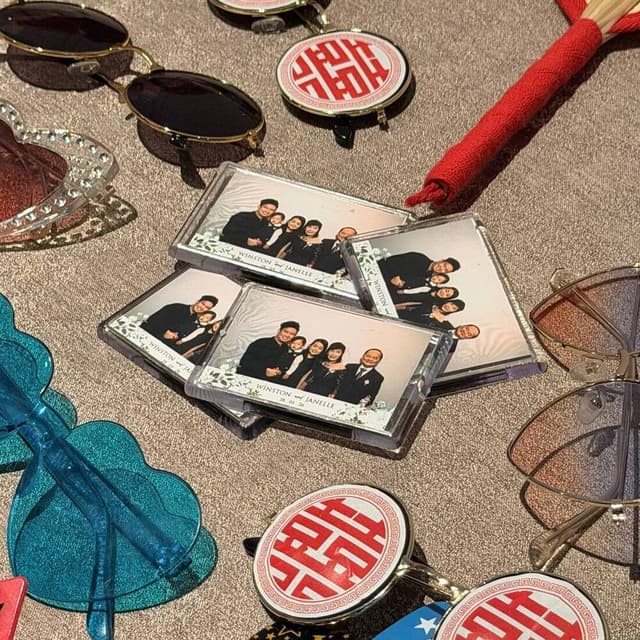 Personalised wedding photo magnets displayed with props
